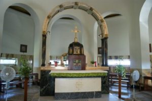 Sunshine lights the eight stained glass windows that proclaim the words of the Beatitudes.