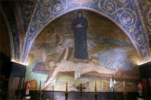 A mosaic shows Jesus being nailed to the Cross.